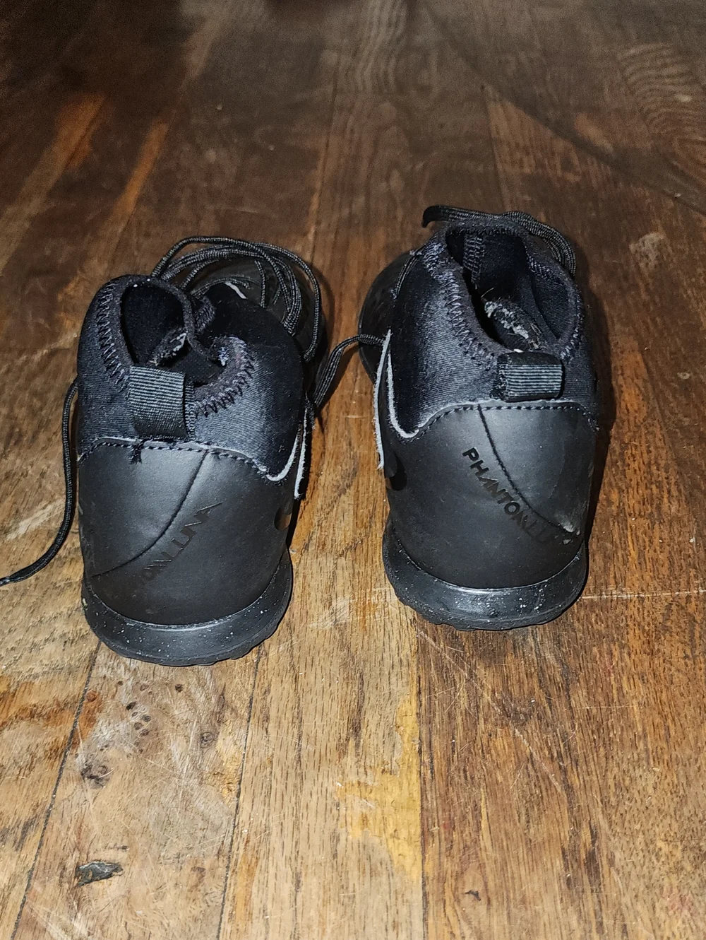 Black Nike Phantom Luna 2 high-top soccer sneakers